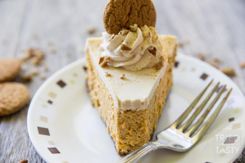 Pumpkin Cheesecake with Gingersnap-Pecan Crust // If you're looking for a light, yet decadent festive desert for the holiday season look no more. This pumpkin cheesecake will quite literally melt in your mouth! Perfectly paired with gingersnaps and pecans it's a dessert you don't want to miss! | Tried and Tasty