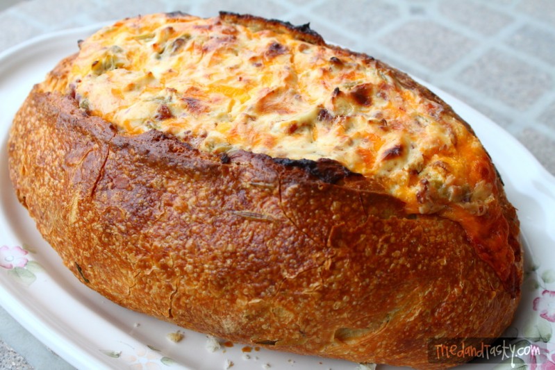 Cheesy Baked Dip // Come see why this is the #1 most viewed recipe on Tried and Tasty! Perfect for any holiday, feeds a crowd - loaded with cheese, ham & bacon (but can easily be made vegetarian!). You don't want to miss this delicious appetizer! | Tried and Tasty