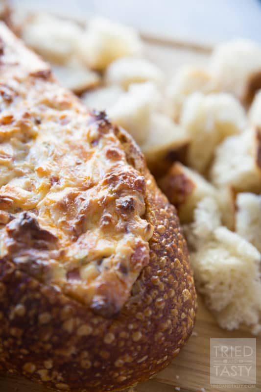 Cheesy Baked Dip // Come see why this is the #1 most viewed recipe on Tried and Tasty! Perfect for any holiday, feeds a crowd - loaded with cheese, ham & bacon (but can easily be made vegetarian!). You don't want to miss this delicious appetizer! | Tried and Tasty
