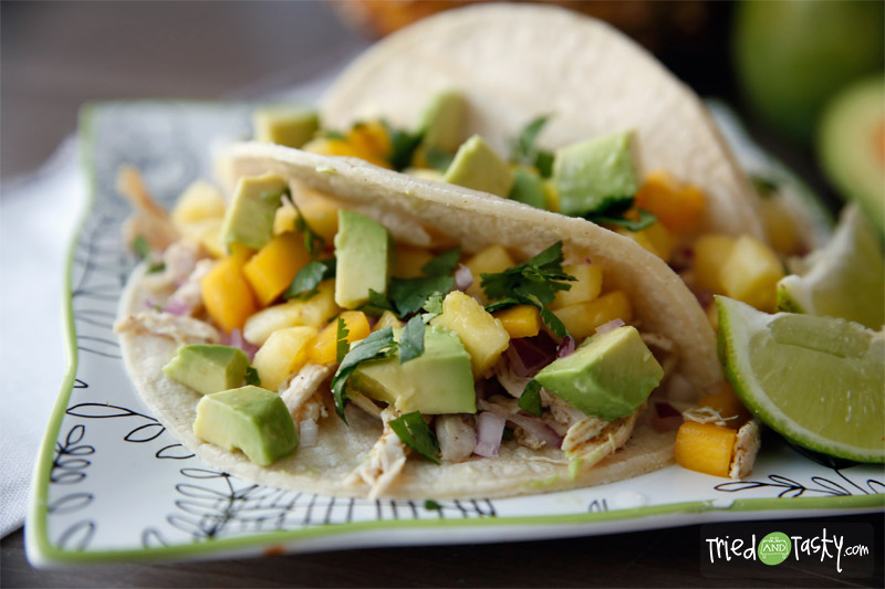 Chicken Tacos with Mango-Pineapple Salsa // These chicken tacos are probably in the top five favorite dish we’ve made to date. They are so light, so fresh, simply put: they are wonderful. Want to know what I love most about them? They are HEALTHY! | Tried and Tasty