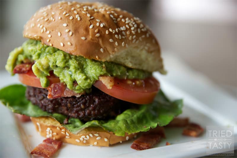 Guacamole Bacon Burger // If you love guacamole, you'll love this burger. It's got the wonderful flavors of guacamole paired with bacon on top of a well-seasoned grilled burger. You won't be disappointed! | Tried and Tasty