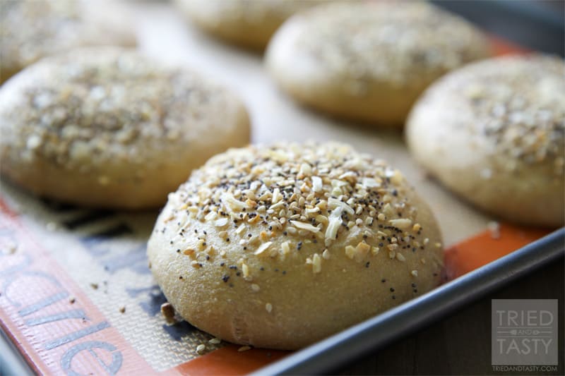 Homemade Whole Wheat Everything Hamburger Buns // If you are familiar with the 'everything' bagel and love it, you will love this hamburger bun. If you aren't familiar with it, you have GOT to give this a try. The smell alone of these baking in the oven is enough to make your senses run wild! | Tried and Tasty