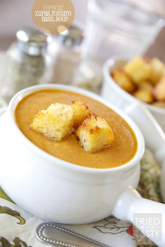 Copycat Zupas Tomato Basil Soup // Enjoy the comfort of Cafe Zupas right in your very own kitchen. With this fantastic Copycat Zupas Tomato Basil Soup recipe you can have your favorite soup anytime you want without so much as stepping one foot outside. This recipe feeds a crowd, make this for your next dinner party! | Tried and Tasty