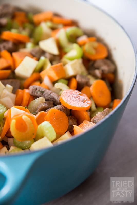 Sweet Potato Beef Stew // This sweet potato stew is made perfectly slow cooker style in the Le Creuset 5 1/2 Qt. French Oven. A handful of healthy ingredients make for a delicious hearty and healthy meal. // Tried and Tasty