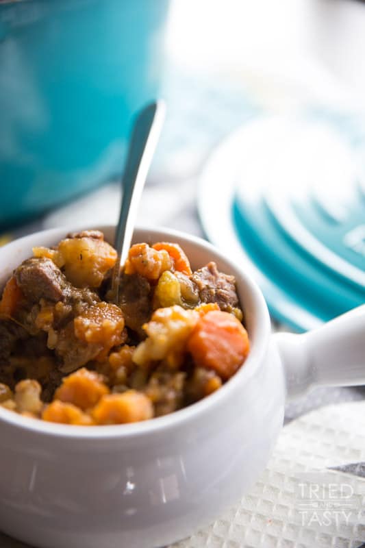 Sweet Potato Beef Stew // This sweet potato stew is made perfectly slow cooker style in the Le Creuset 5 1/2 Qt. French Oven. A handful of healthy ingredients make for a delicious hearty and healthy meal. // Tried and Tasty