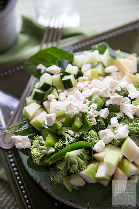 The Ultimate Green Salad // Ever thought of celebrating St. Patrick's Day and not sure what to eat that's nutritious and free of artificial food coloring? This would be an excellent GREEN meal (or starter) to serve to your family! All delicious fruits and vegetable served atop fresh spinach & drizzled with tasty tomatillo dressing. YUM! // Tried and Tasty