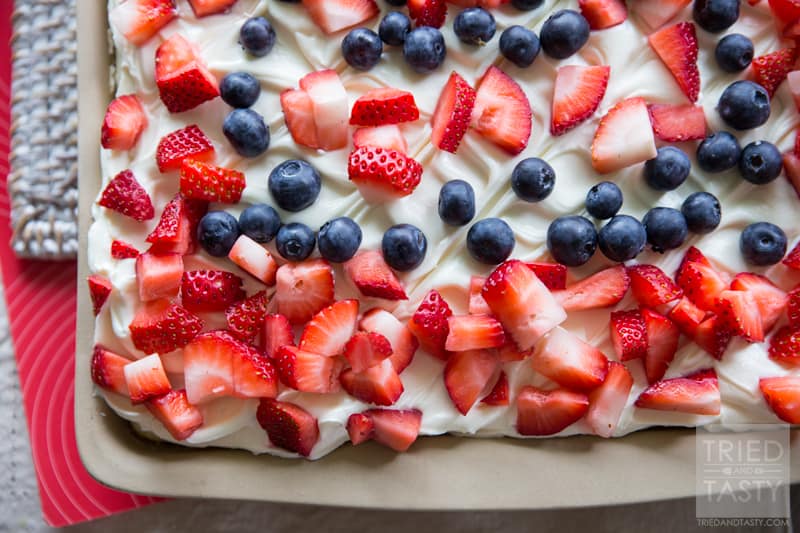 Berries 'n Cream Cheese Cake // Looking for a light, delicious, and EASY treat to feed a crowd? This sheet cake is perfect for parties, family gatherings, BBQ's and potlucks! You'll be amazed at how simple it is to put together! | Tried and Tasty