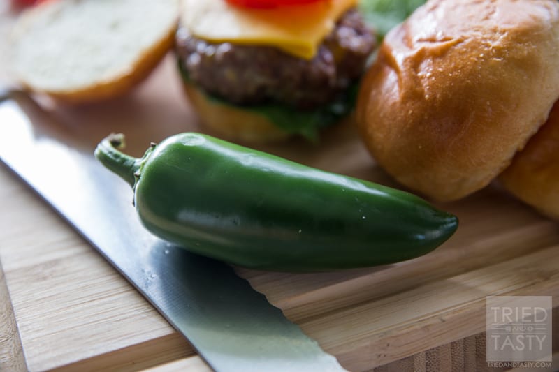 Cowboy Burger // Grilling doesn't have to be boring. In fact, it can make for some of the best grub you've ever had! These Cowboy Burgers are loaded with flavor. Best part about it? You can keep the heat if you like 'em spicy or ditch the heat if you like a milder flavor. All you have to do is adjust the jalapeno seed accordingly! Add these to your grilling menu immediately! | Tried and Tasty