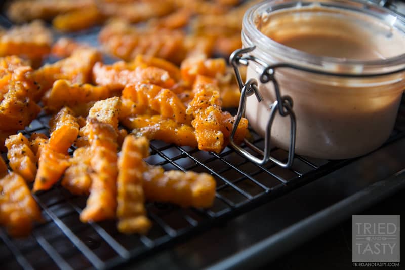 Crinkle Cut Sweet Potato Fries // Why buy storebought sweet potato fries when you can make your own? These are just like what you'd find at the store but only better! With just a few ingredients, these would be the perfect side dish for any grilled hamburgers or hot dogs at your next BBQ! | Tried and Tasty