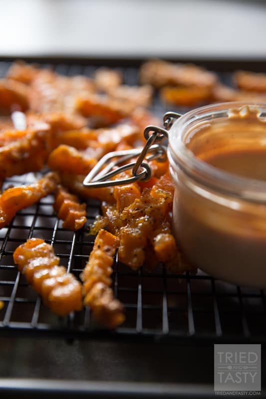 Crinkle Cut Sweet Potato Fries // Why buy storebought sweet potato fries when you can make your own? These are just like what you'd find at the store but only better! With just a few ingredients, these would be the perfect side dish for any grilled hamburgers or hot dogs at your next BBQ! | Tried and Tasty