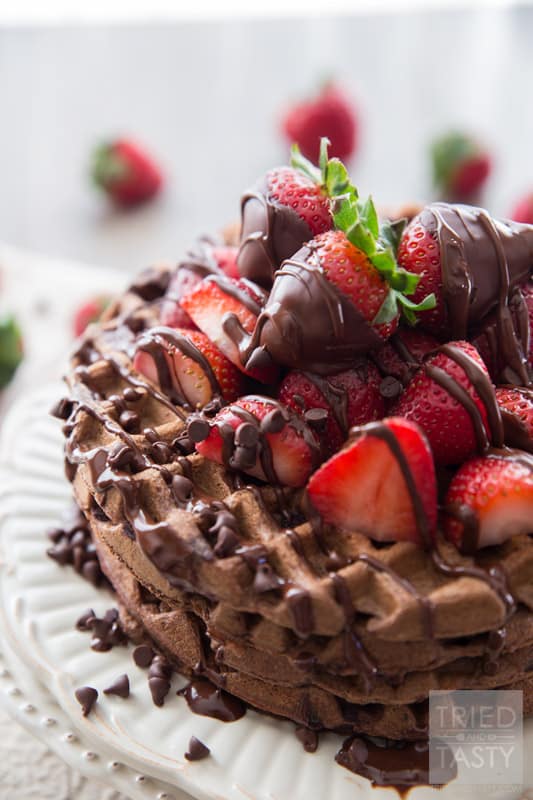 Whole Wheat Dark Chocolate Covered Strawberry Waffles // Looking for a fun new way to enjoy breakfast? Try these delicious chocolate waffles. The best part about them? They are actually not bad for you! You'll be surprised that they are made with whole wheat flour and no refined sugar! Drizzled with dark chocolate and covered with fresh strawberries. A beautiful way to start your morning! | Tried and Tasty