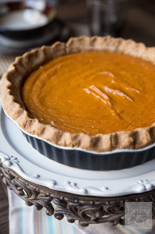 Mom's Sweet Potato Pie // This sweet potato pie is legendary and has been passed down from my grandfather and grandmother to my own mother and now to me. This is the MUST HAVE recipe of the fall season that can be enjoyed for Halloween, Thanksgiving, and any other day of the year! The perfect addition to any dessert table. | Tried and Tasty