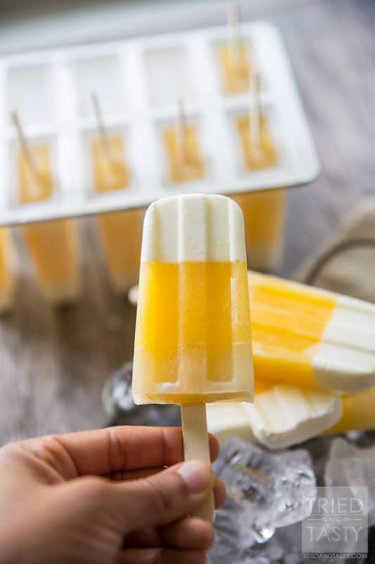 Tropical Candy Corn Popsicles // This 'candy corn' inspired treat is a healthy variation for all of your guilt-free treat needs! Perfectly tropical with the flavors of coconut, pineapple and orange you're tastebuds will say THANK YOU! | Tried and Tasty