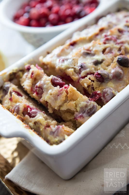 Lemon Cranberry Bread // This gorgeous citrus sweet bread is not only a stunner, but perfect for your holiday dessert table. A little bit of tart, a little bit of sweet, and a whole lot of delicious! | Tried and Tasty