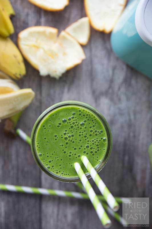 Banana Orange Green Smoothie // Doesn't get any easier than this delicious smoothie! All you need are a few key ingredients and you'll be on your way to a nutrition packed, no-sugar added, simple smoothie. Perfect to jump start your morning. Great for a mid-afternoon pick-me-up. Great for an afternoon snack the whole family will enjoy! | Tried and Tasty