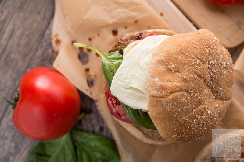 Caprese Burger // 5 Ingredients (plus balsamic vinegar) and you'll be well on your way to the most delicious Italian inspired burger that will wow your tastebuds. This juicy burger is great for any BBQ. Fire up the grill and serve this up all summer long! | Tried and Tasty