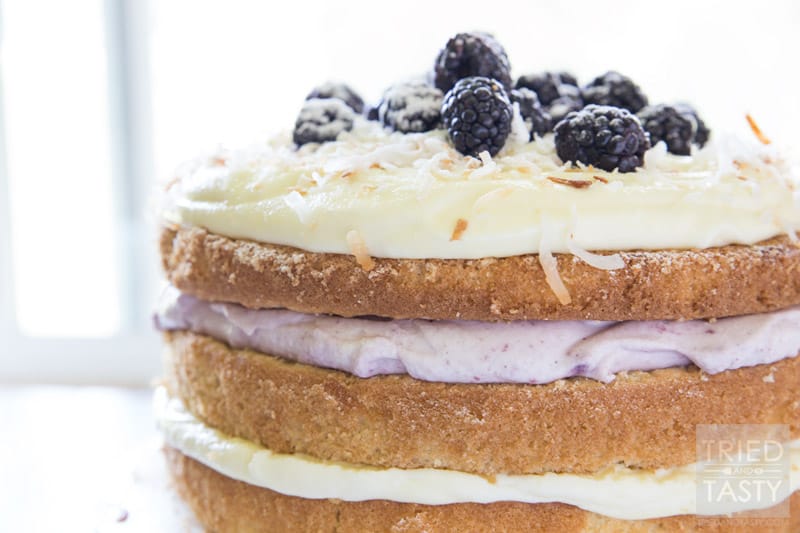 Blackberry Pina Colada Cake // Do you love Pina Coladas? You'll want to get your hands on this fun twist. With the addition of blackberry you've got a next level fruit explosion. The flavors marry together beautifully! | Tried and Tasty