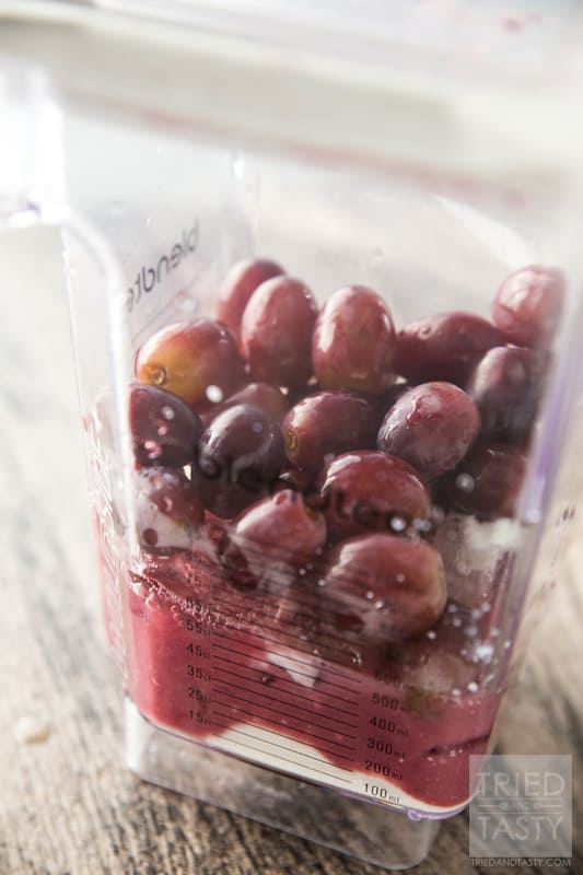 Simple Grape Smoothie // Ever had a grape smoothie before? The next time you buy red grapes - keep this in mind. It's the perfect balance of sweet & tart and has just a few ingredients. Spin a quick cycle in your blender and you'll have a great way to start your day or pick-me-up when you need it! | Tried and Tasty