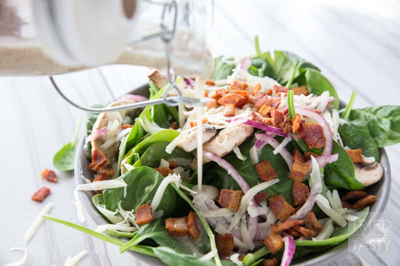 Spinach Salad // You wiill fall in love at first taste with this salad. A delicious combination of so many wonerful flavors. Great addition to any dinner table spread. Great for BBQ's, picnics, potlucks, or holiday parties. Simple to put together! | Tried and Tasty