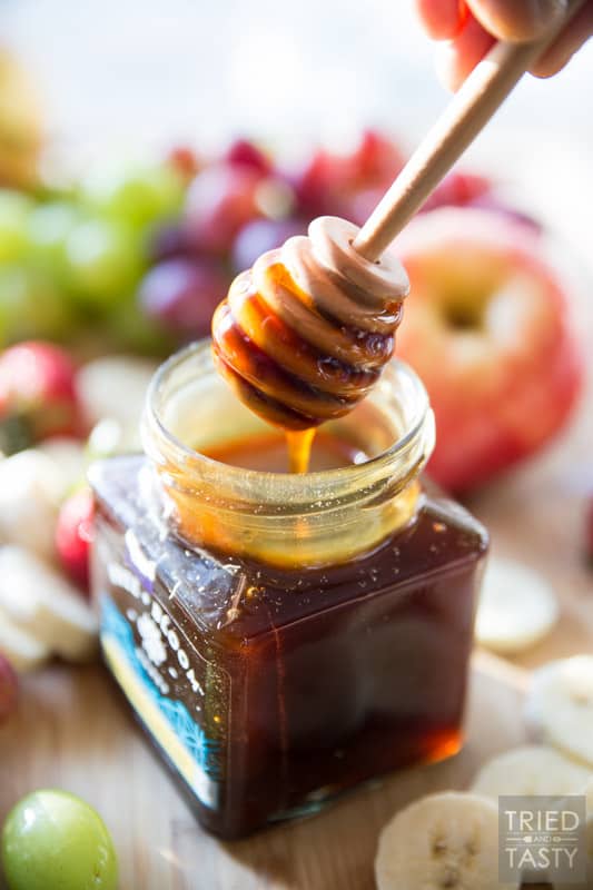 Honey Sweetened- Fruit Dip // Fruit is already sweet, so you don't need a sugar loaded dip to dunk it in. This fruit dip is absolutely perfect. It's light. It's fluffy. And it's *just* sweet enough, and sweetened all naturally with honey! Serve this at your next potluck or party and everyone will want the recipe! | Tried and Tasty