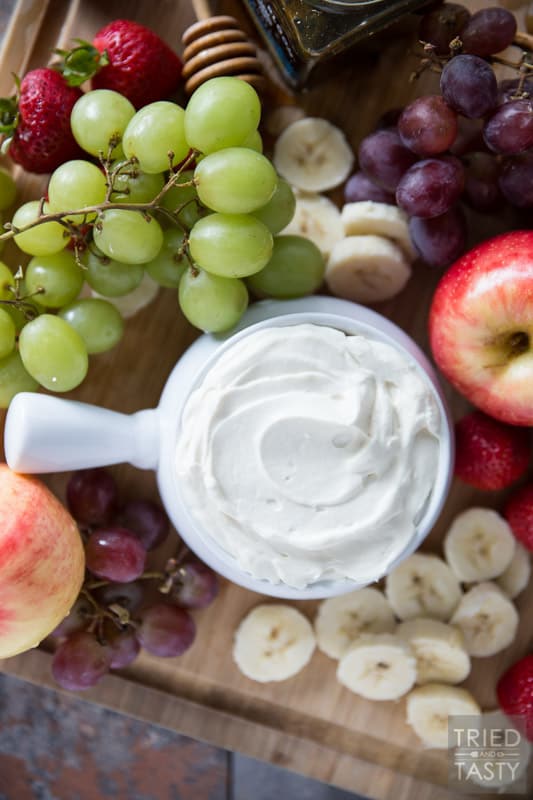 Honey Sweetened- Fruit Dip // Fruit is already sweet, so you don't need a sugar loaded dip to dunk it in. This fruit dip is absolutely perfect. It's light. It's fluffy. And it's *just* sweet enough, and sweetened all naturally with honey! Serve this at your next potluck or party and everyone will want the recipe! | Tried and Tasty