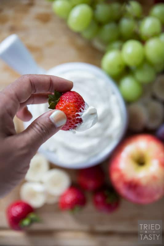 Honey Sweetened- Fruit Dip // Fruit is already sweet, so you don't need a sugar loaded dip to dunk it in. This fruit dip is absolutely perfect. It's light. It's fluffy. And it's *just* sweet enough, and sweetened all naturally with honey! Serve this at your next potluck or party and everyone will want the recipe! | Tried and Tasty