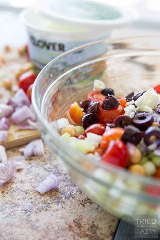 Mediterranean Chickpea Salad // This salad SCREAMS garden goodness! If you're growing tomatoes, cucumber, and dill... I recommend you grab everything else you need to put this together. It's absolutely delightful and perfect paired with homemade baked pita chips! | Tried and Tasty