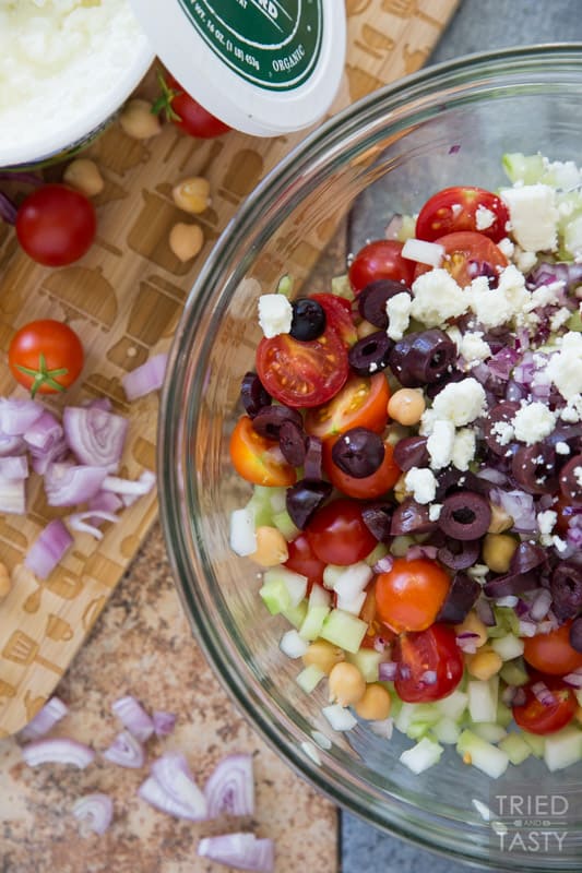 Mediterranean Chickpea Salad // This salad SCREAMS garden goodness! If you're growing tomatoes, cucumber, and dill... I recommend you grab everything else you need to put this together. It's absolutely delightful and perfect paired with homemade baked pita chips! | Tried and Tasty