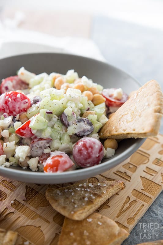 Mediterranean Chickpea Salad // This salad SCREAMS garden goodness! If you're growing tomatoes, cucumber, and dill... I recommend you grab everything else you need to put this together. It's absolutely delightful and perfect paired with homemade baked pita chips! | Tried and Tasty