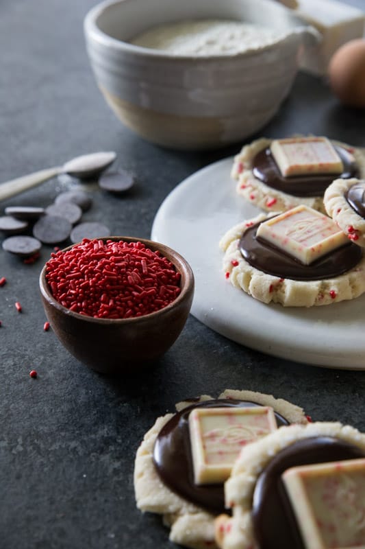 Chocolate Peppermint Bark Sugar Cookies // This unique twist on 'peppermint bark' will have you swooning. Chocolate ganache meets the most delicious peppermint sugar cookie! The ultimate holiday cookie (perfect for a cookie exchange)! | Tried and Tasty