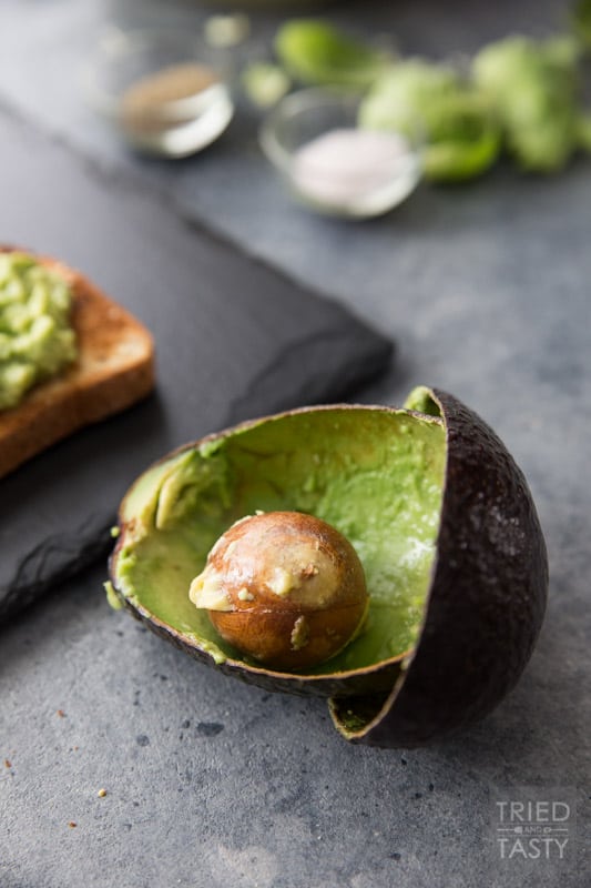 Cheesy Brussels Sprouts and Avocado Toast // Avocado toast is all the rage. However. You haven't had THIS avocado toast before! This will change your life. Even if you don't like avocados you will LOVE this delicious combination. This recipe has everything you want in an avo toast: a little bit of crunch, a little bit of cheese, some veggies and a whole lot of flavor. | Tried and Tasty