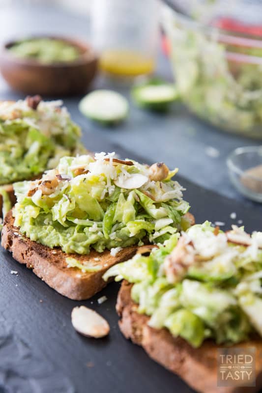 Cheesy Brussels Sprouts and Avocado Toast // Avocado toast is all the rage. However. You haven't had THIS avocado toast before! This will change your life. Even if you don't like avocados you will LOVE this delicious combination. This recipe has everything you want in an avo toast: a little bit of crunch, a little bit of cheese, some veggies and a whole lot of flavor. | Tried and Tasty