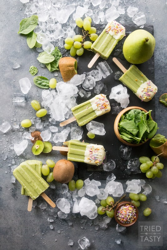White Chocolate Dipped Kiwi Popsicles // Want a treat and want it to be healthy? These popsicles are exactly what you are looking for. Just blend, freeze, dip & enjoy! Made with the most delicious fruits and no added sugar! | Tried and Tasty
