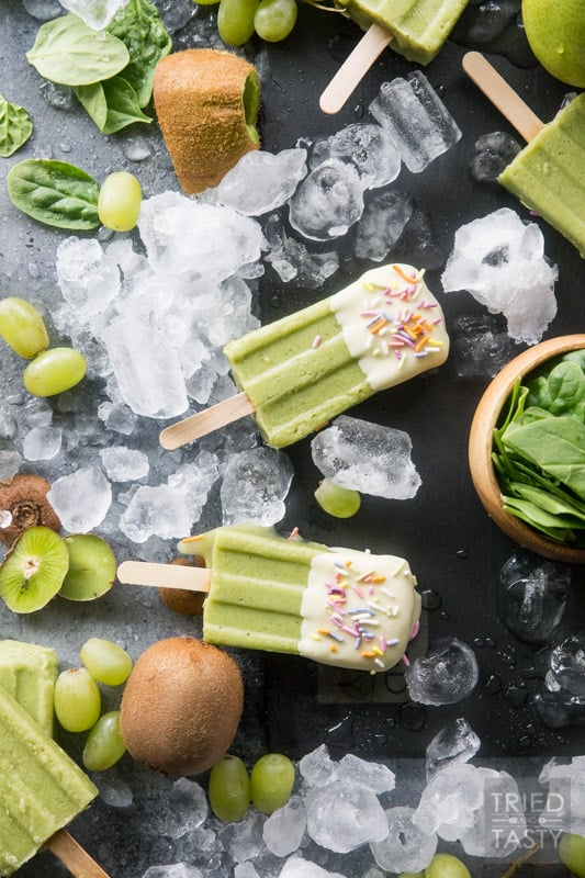 White Chocolate Dipped Kiwi Popsicles // Want a treat and want it to be healthy? These popsicles are exactly what you are looking for. Just blend, freeze, dip & enjoy! Made with the most delicious fruits and no added sugar! | Tried and Tasty