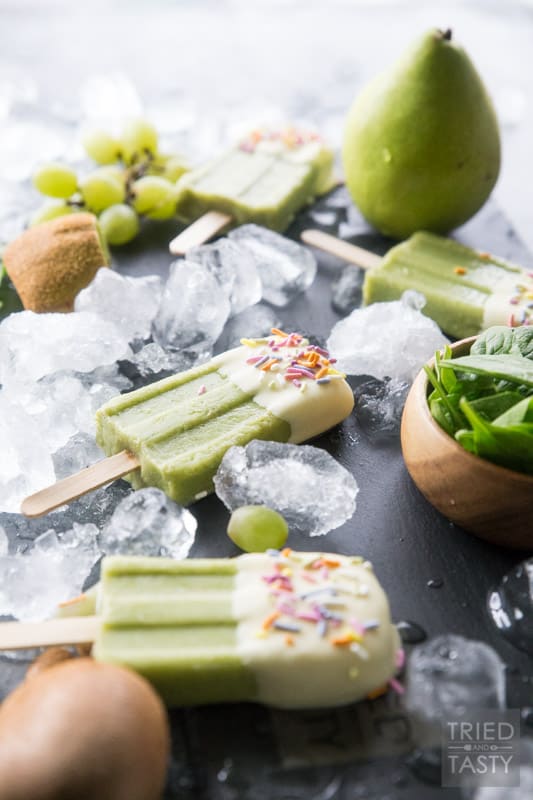 White Chocolate Dipped Kiwi Popsicles // Want a treat and want it to be healthy? These popsicles are exactly what you are looking for. Just blend, freeze, dip & enjoy! Made with the most delicious fruits and no added sugar! | Tried and Tasty