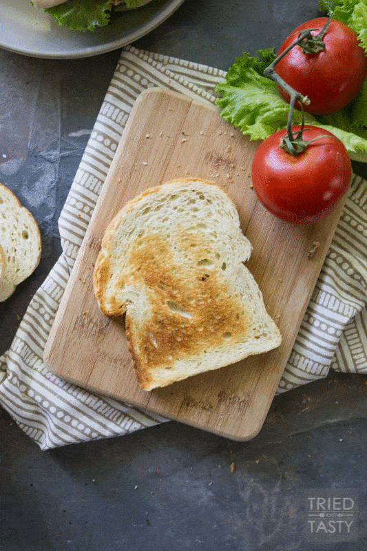 Triple Decker Deli Sandwich // This is the sandwich of all sandwiches that you WILL want to have all summer long! Lunch won't be the same again with this delicious triple decker threat! You'll want to stop by to see the secret ingredient |Tried and Tasty