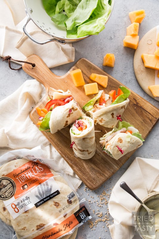 Turkey and Swiss Wrap // Lunch doesn't get easier (or tastier) than this! Start with a high quality tortilla, top with a few of your favorite things, slice and voila! Lunch is served! | Tried and Tasty