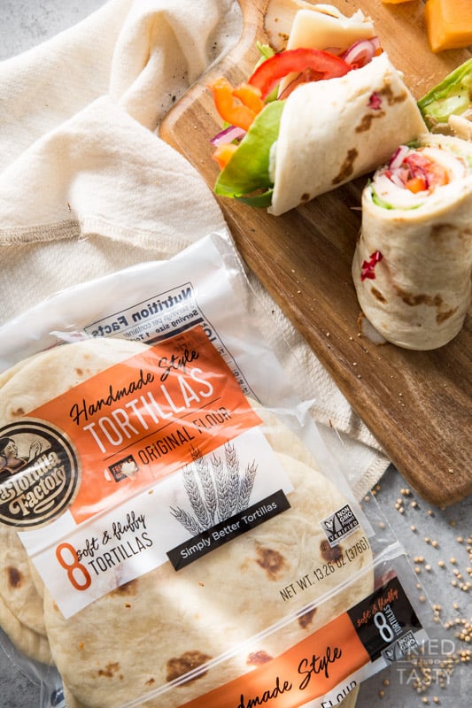 Turkey and Swiss Wrap // Lunch doesn't get easier (or tastier) than this! Start with a high quality tortilla, top with a few of your favorite things, slice and voila! Lunch is served! | Tried and Tasty