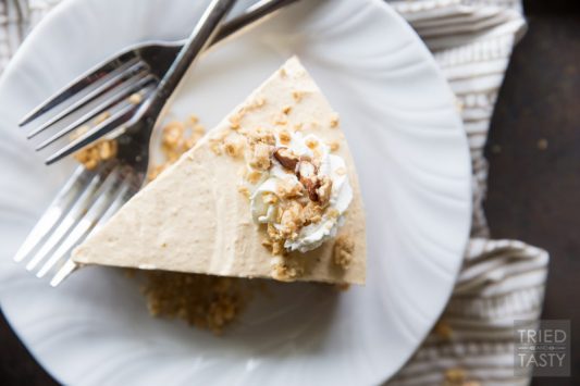 Almost No Bake Maple Pecan Pumpkin Cheesecake // You'd never guess the secret ingredient in the crust of this delicious cheesecake! I'll give you a hint: it's not graham cracker! With a light pumpkin flavor, this cheesecake is perfectly sweetened with a touch of maple & pecan. | Tried and Tasty