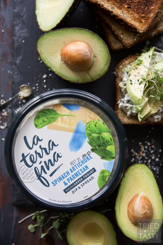 Savory Avocado Toast // This quick and easy snack that could double as breakfast or triple as lunch is simple to make & packed with nutrients! The twist? A smattering of spinach & artichoke dip underneath! | Tried and Tasty