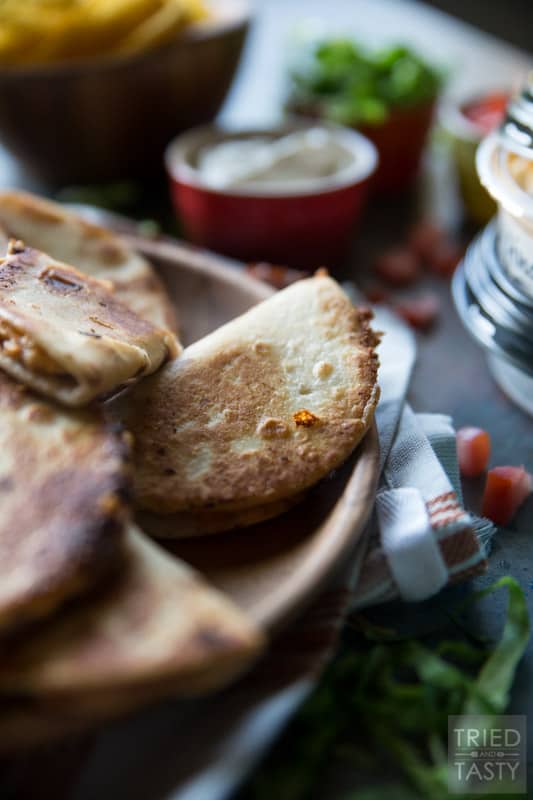 Mini Bean and Three-Cheese Quesadillas // The perfect summertime finger food that's not only delicious but equally portable. Packed full of cheesy flavor you'll fall in love at first bite! | Tried and Tasty