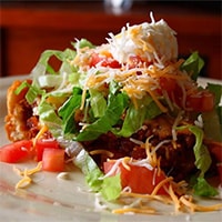 Ground beef with Taco Seasoning on a stack of Lettuce